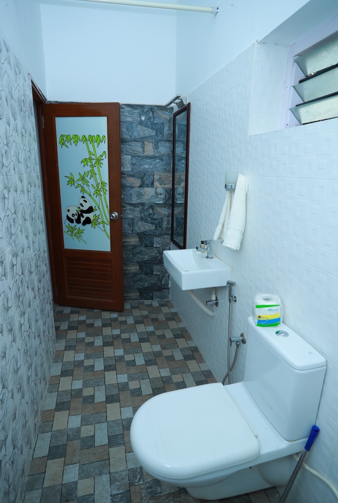 Clean attached bathroom at Lacasa Homestay