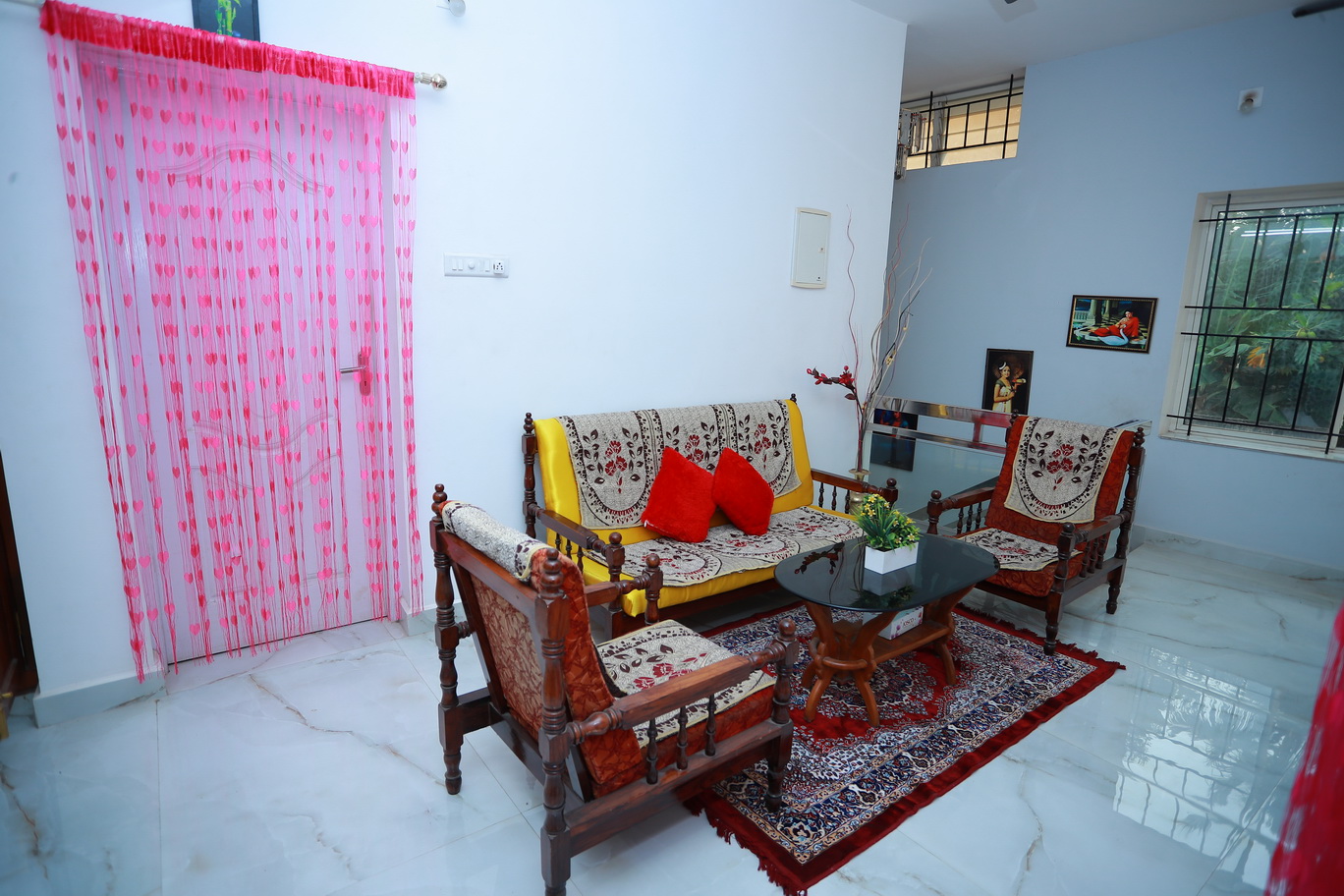 Bright sitting area with yellow sofa at Lacasa