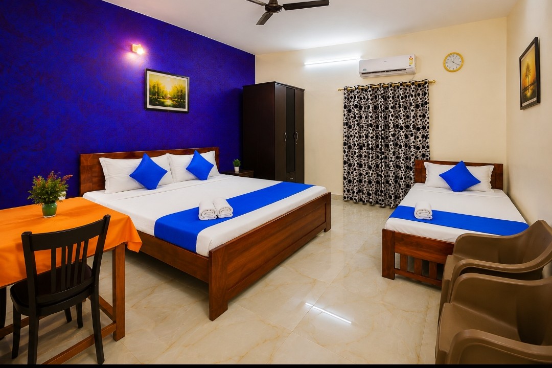 Deluxe Family Room with blue accent wall at Lacasa